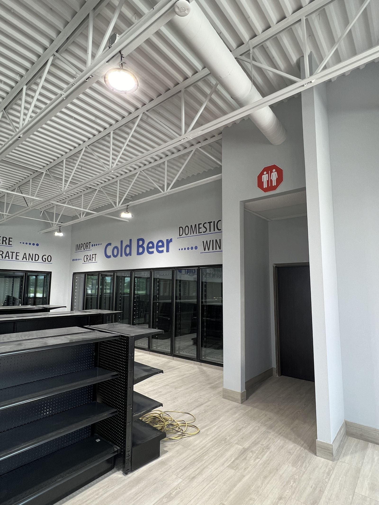 Cold beer cooler wall graphics in a convenience store