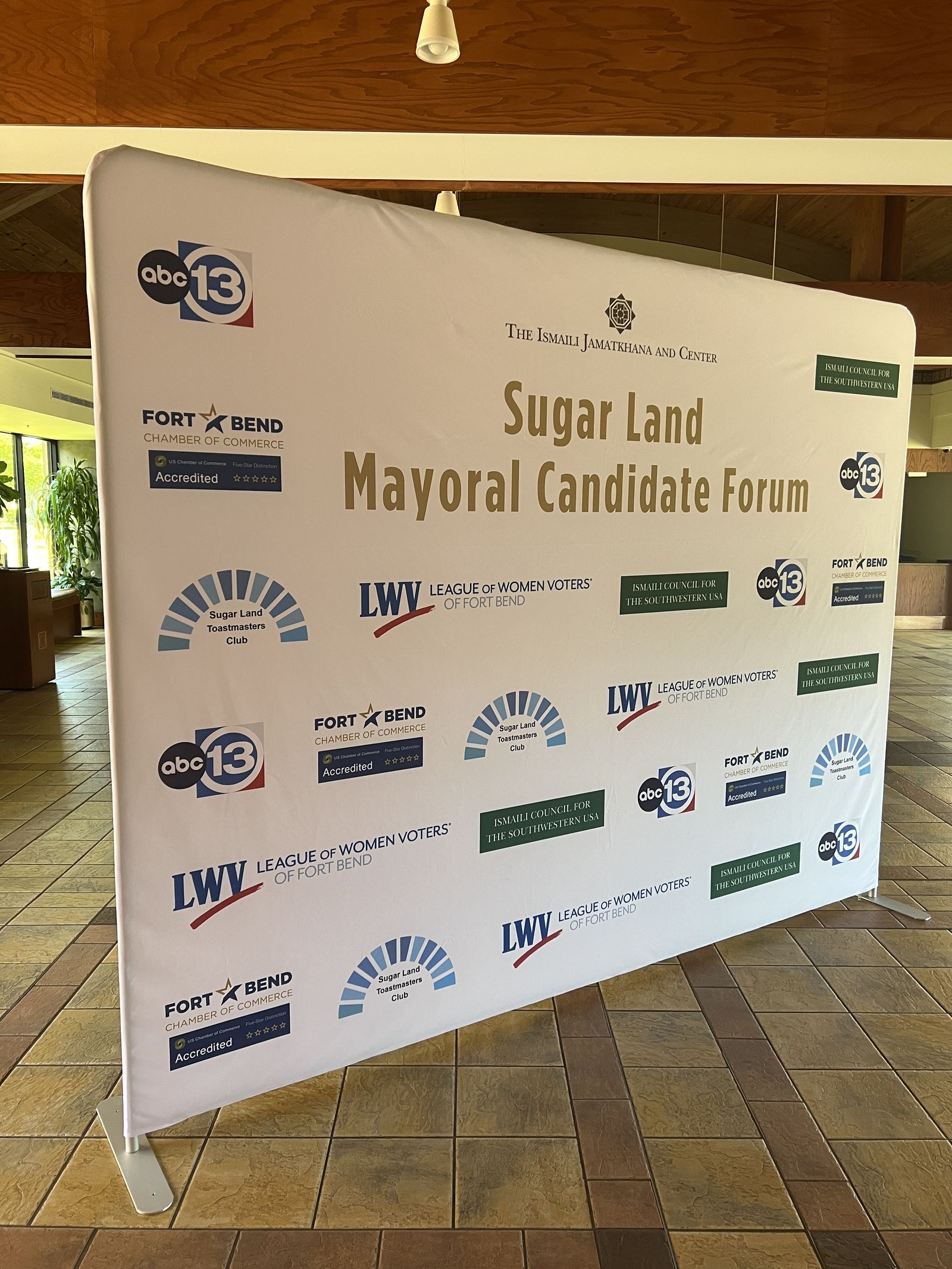 Step-and-repeat event backdrop for a candidate forum