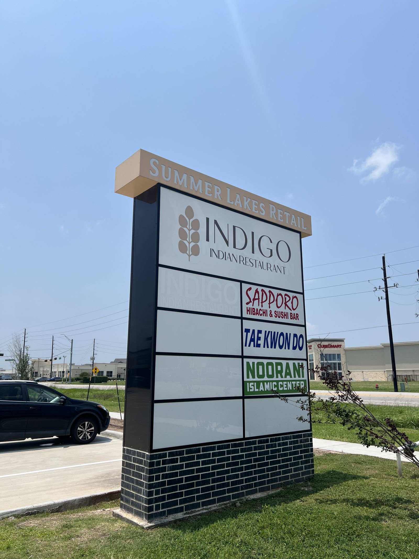 Multi-tenant pylon sign for Indigo Plaza with tenant panels