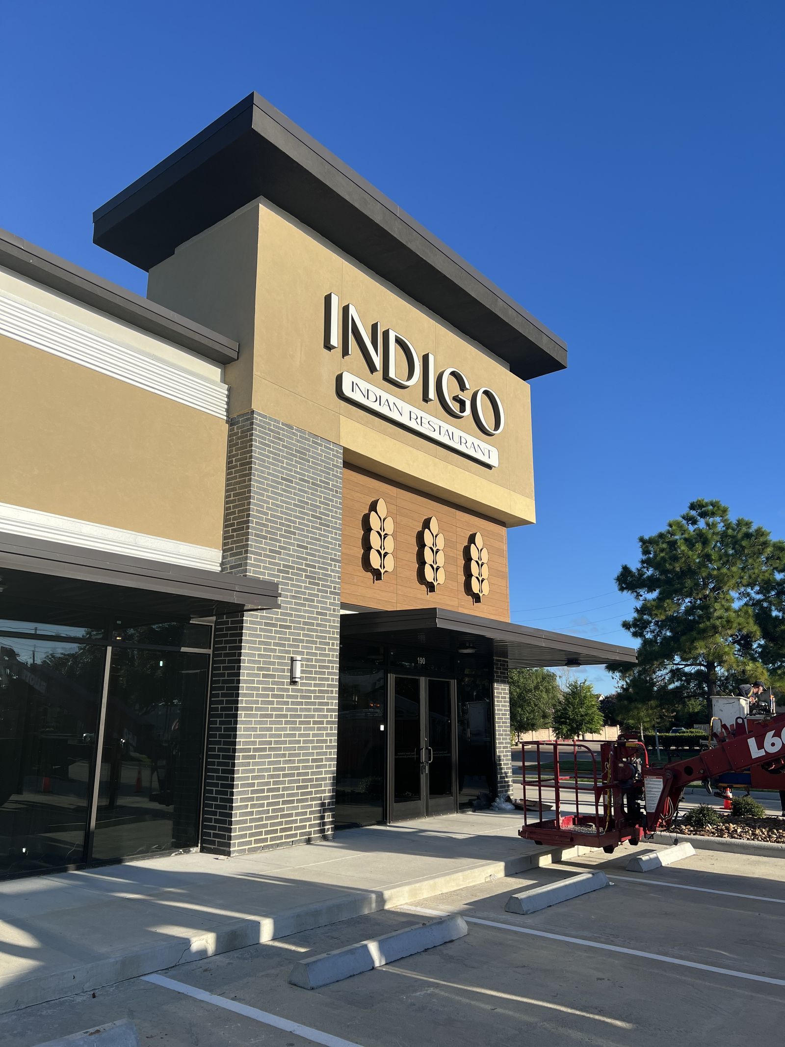 Dimensional storefront letters for Indigo on a modern retail facade
