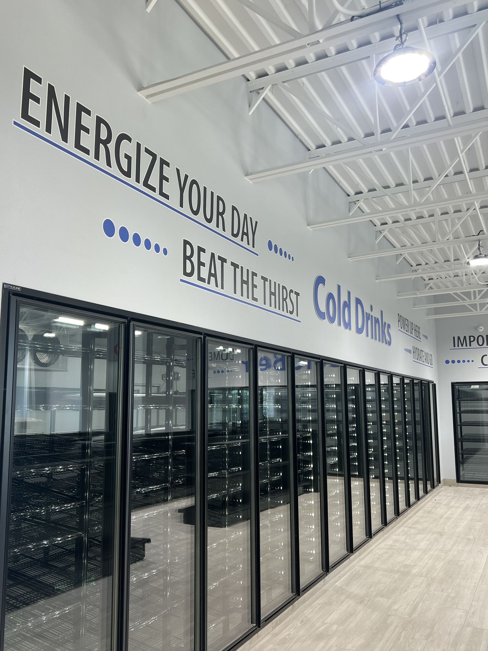 Energize your day wall graphics along a cooler wall